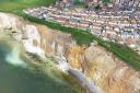 7 shocking drone images show extent of cliff fall metres from homes