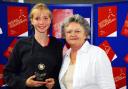 Bethany receives her women's singles trophy from Sue Mappin, executive director of The Tennis Foundation