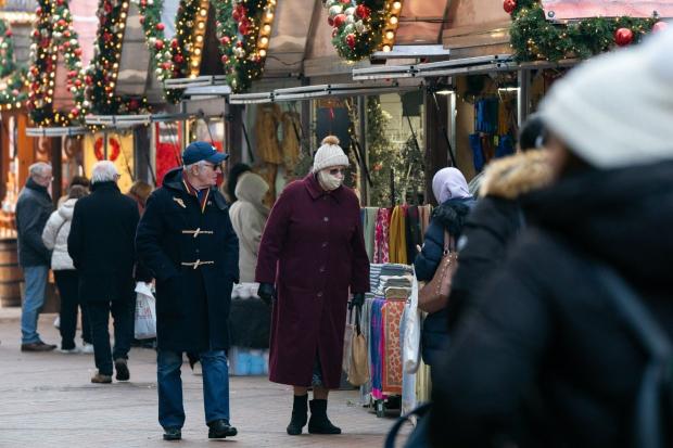 People browsing the Christmas market in Nottingham, the city where one of the two cases of the Omicron variant of Covid-19 were identified last week. Photo: PA.