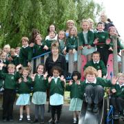 Dovers Green pupils celebrate with headteacher Sue Hillman standing centre front