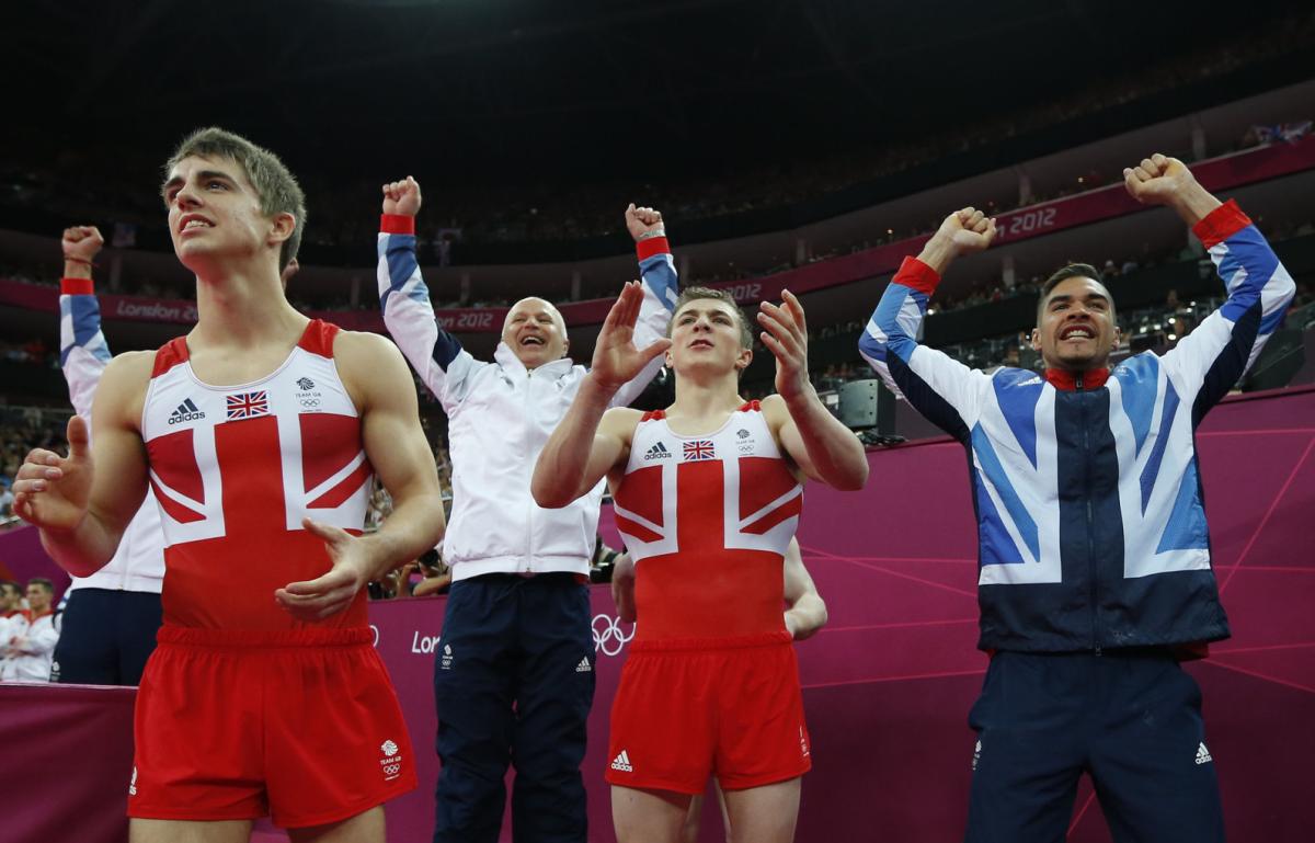 Team GB celebrates winning the silver medal at the Artistic Gymnastic men's team final - only to be relegated to bronze after an appeal by Japan...Still a major achievement!