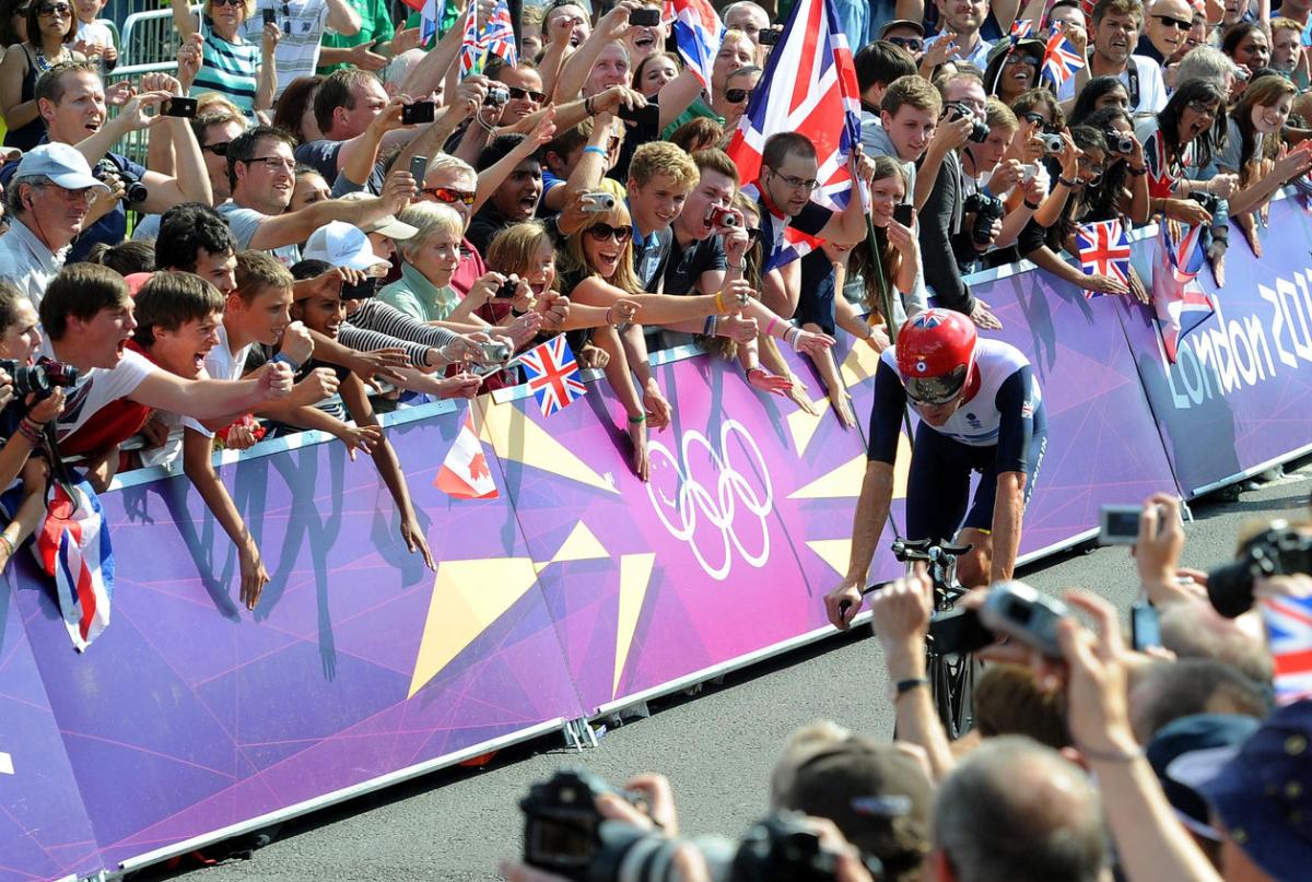 Team GB's Bradley Wiggins celebrates winning the Men's Individual Time Trial on day five of the London Olympic Games at Hampton Court Palace...