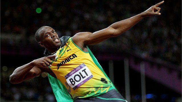 Jamaica's Usain Bolt celebrates after winning the 100m crown.... 
